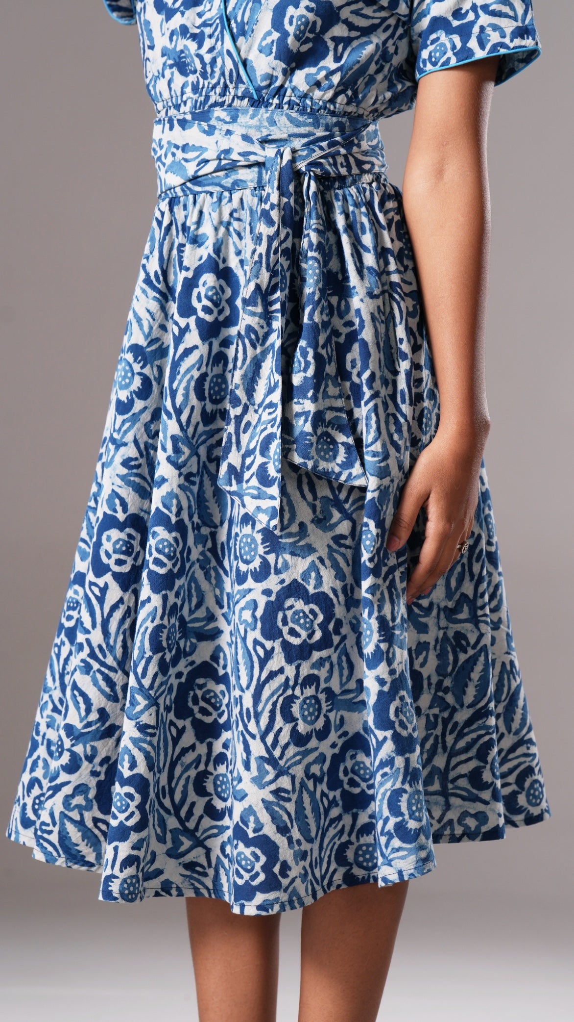 Blue floral dress on a plain background